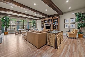 club house living room with a couch and a fireplace